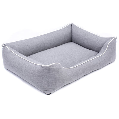 Sofá Mallorca Comfort cama para perro en gris claro con ribete blanco 65x50 cm